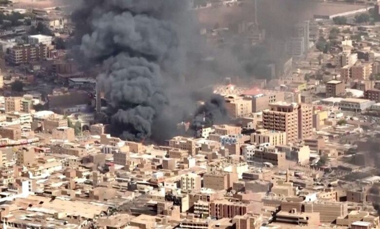 An aerial view of the black smoke and flames at a market in Omdurman